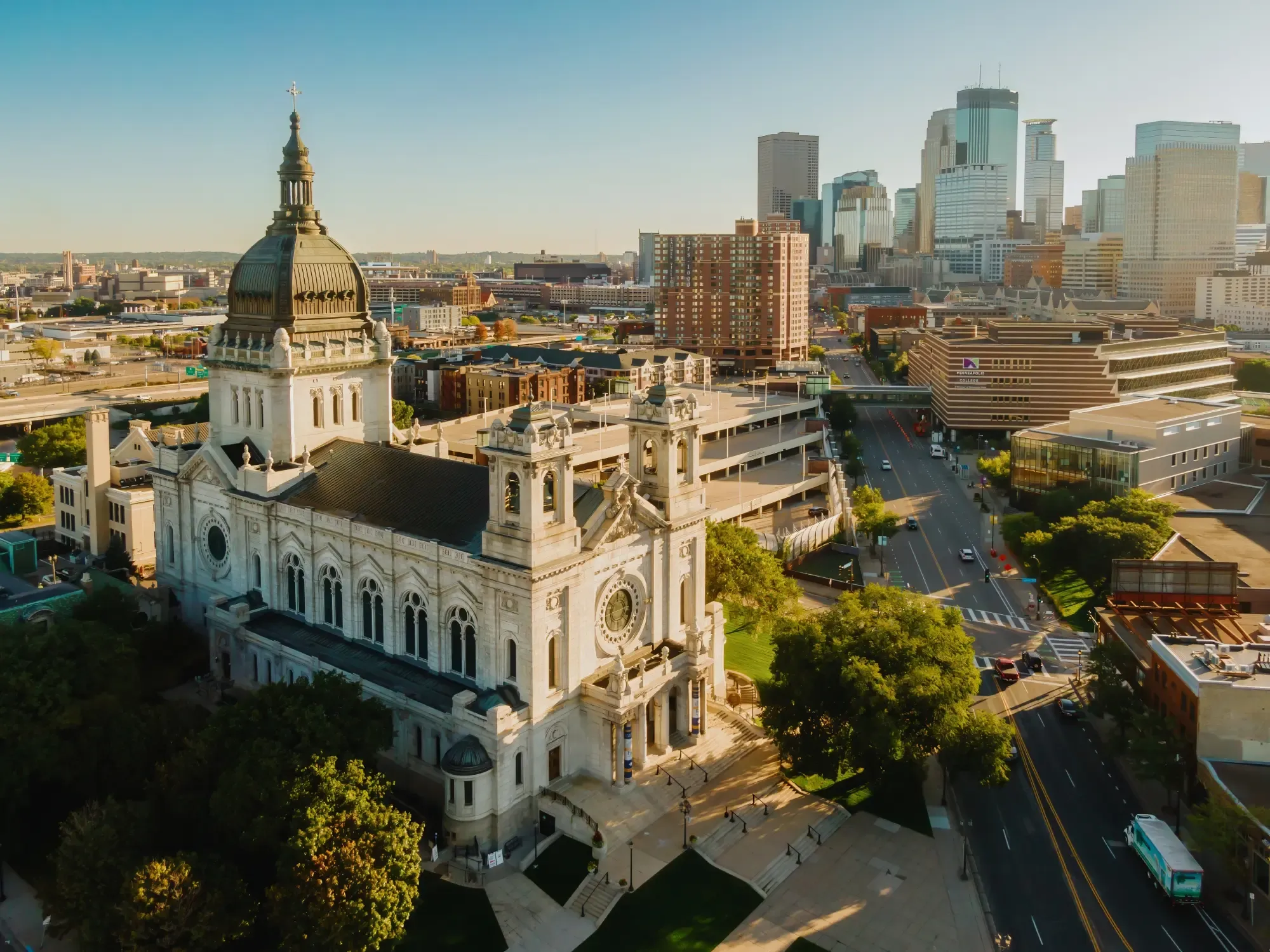 Aerial view of Minneapolis, MN, showcasing the Basilica of St. Mary's and the city skyline